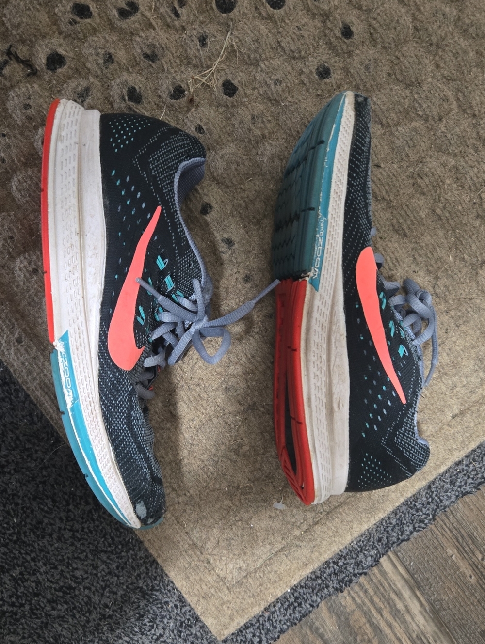 Nike Women's Black Running Shoes with Coral Swoosh and Teal Accents